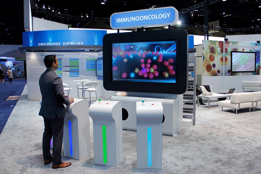 medical illustration of A highly engaging multi-player, immuno-oncology educational game featured at ASCO, ASH and online. Playing the role of cytotoxic T cells in an evolutionary arms race with cancer cells, users interact with an AI-driven population of cancer cells that proliferate and evolve evasive mechanisms. Simple interactions and custom controllers improved accessibility for users with limited gaming experience. Built-in analytics provide metrics to measure ROI.